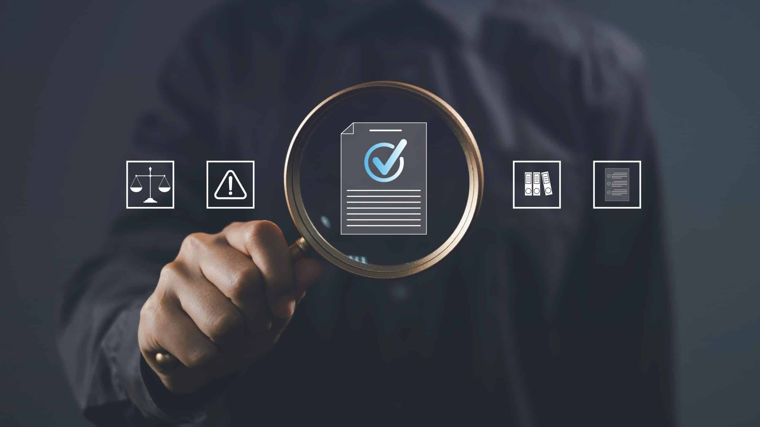 Magnifying glass over document with check mark