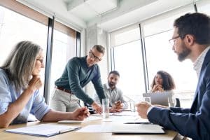 Diverse team in business meeting discussion.
