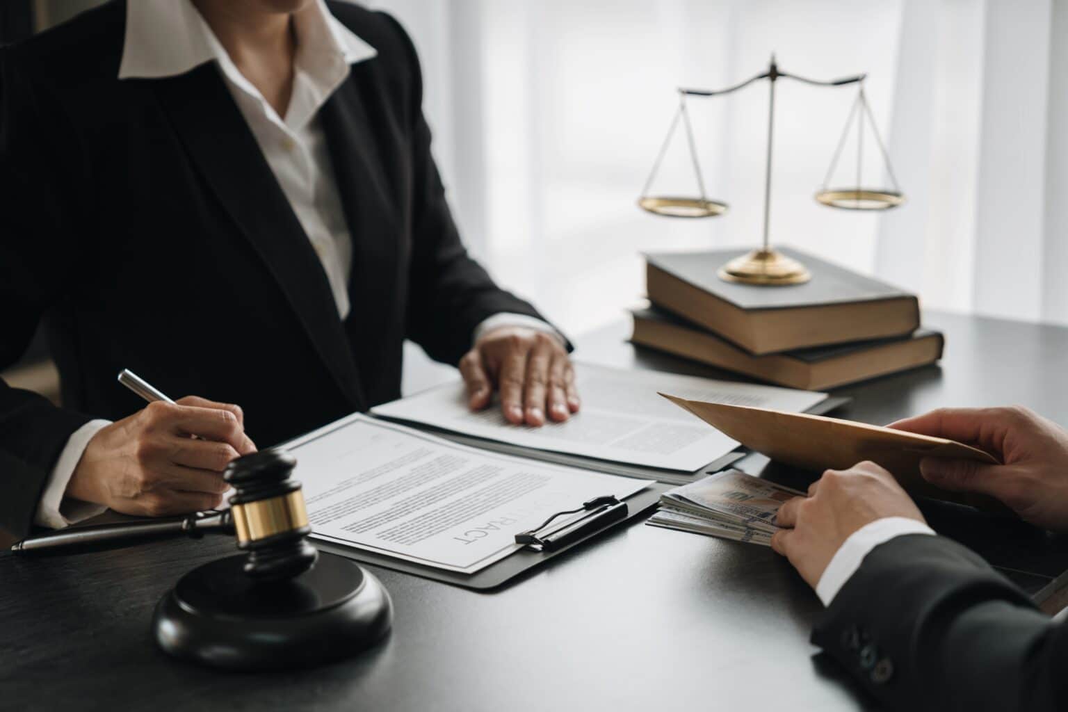 Lawyers discussing legal documents in an office.