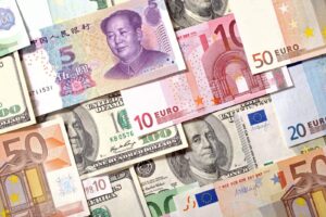 Variety of international currencies: euros, dollars, yuan.