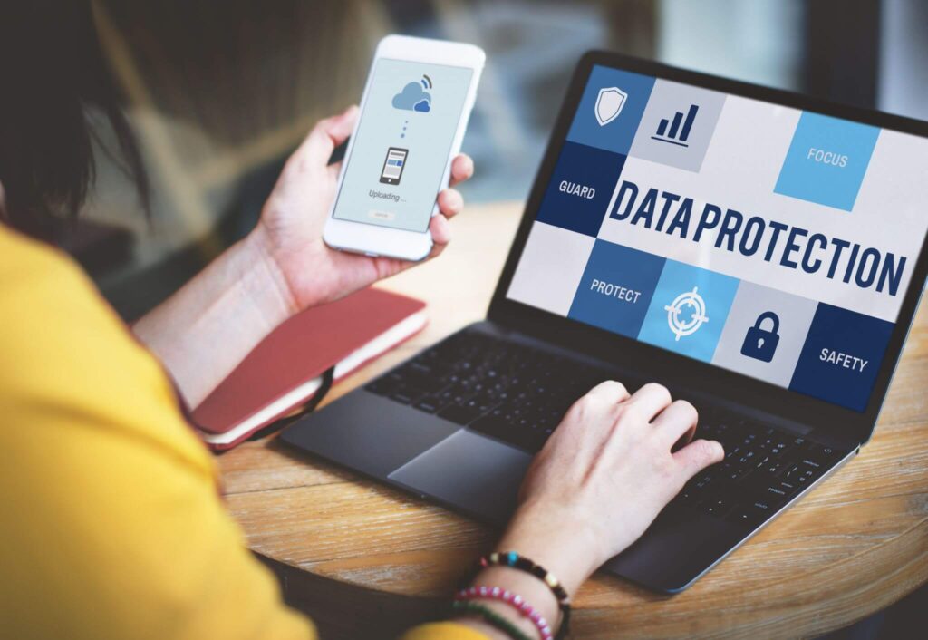 Person using cloud data protection tools on devices.