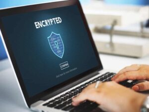 Laptop screen displaying encrypted security message.