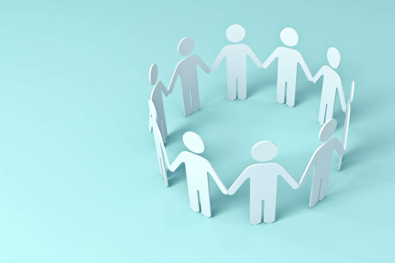 Paper figures holding hands in a circle.