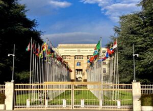 United Nations building with international flags outside.