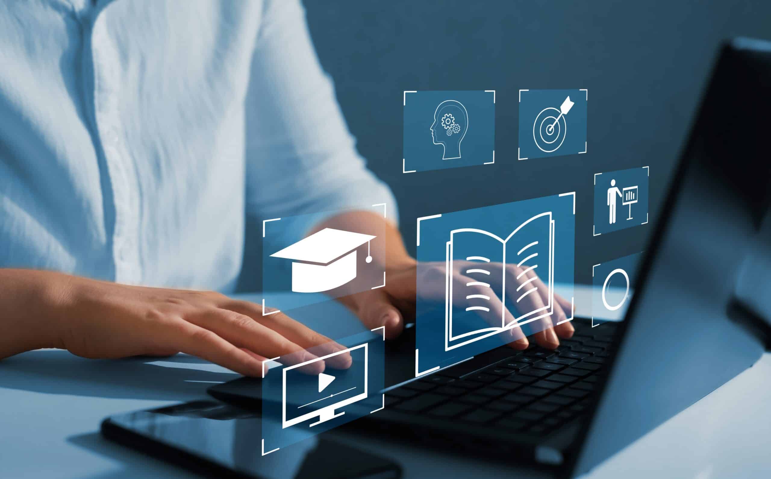 Person using a laptop with educational icons.