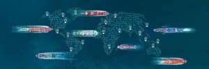 Cargo ships on the sea with an overlay of a digital global map