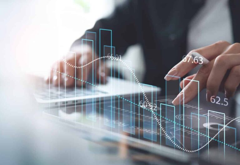 Person analyzing data on a laptop.