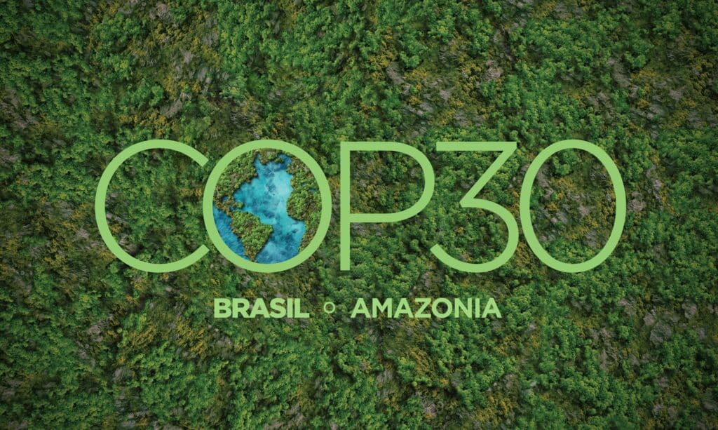 COP30 logo with lush green Amazon rainforest background