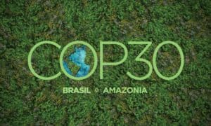 COP30 logo with lush green Amazon rainforest background