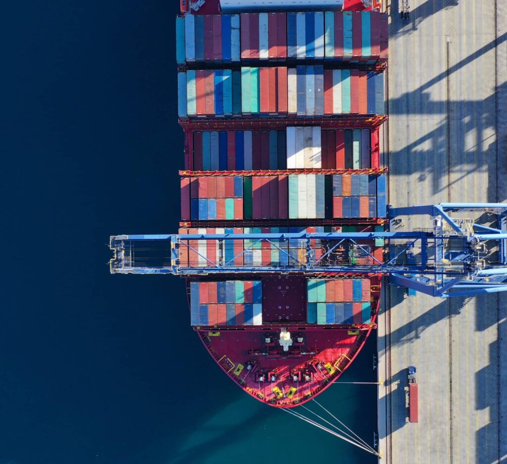 Aerial view of a cargo ship at port.