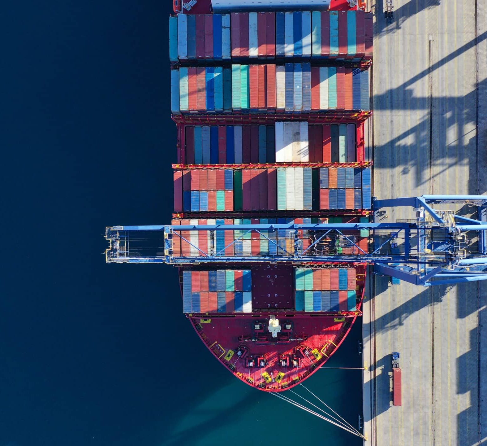 Aerial view of a cargo ship at port.
