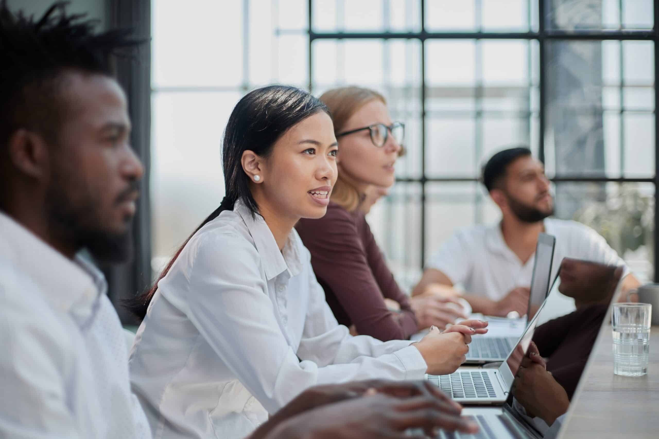 Diverse professionals engaged in a meeting