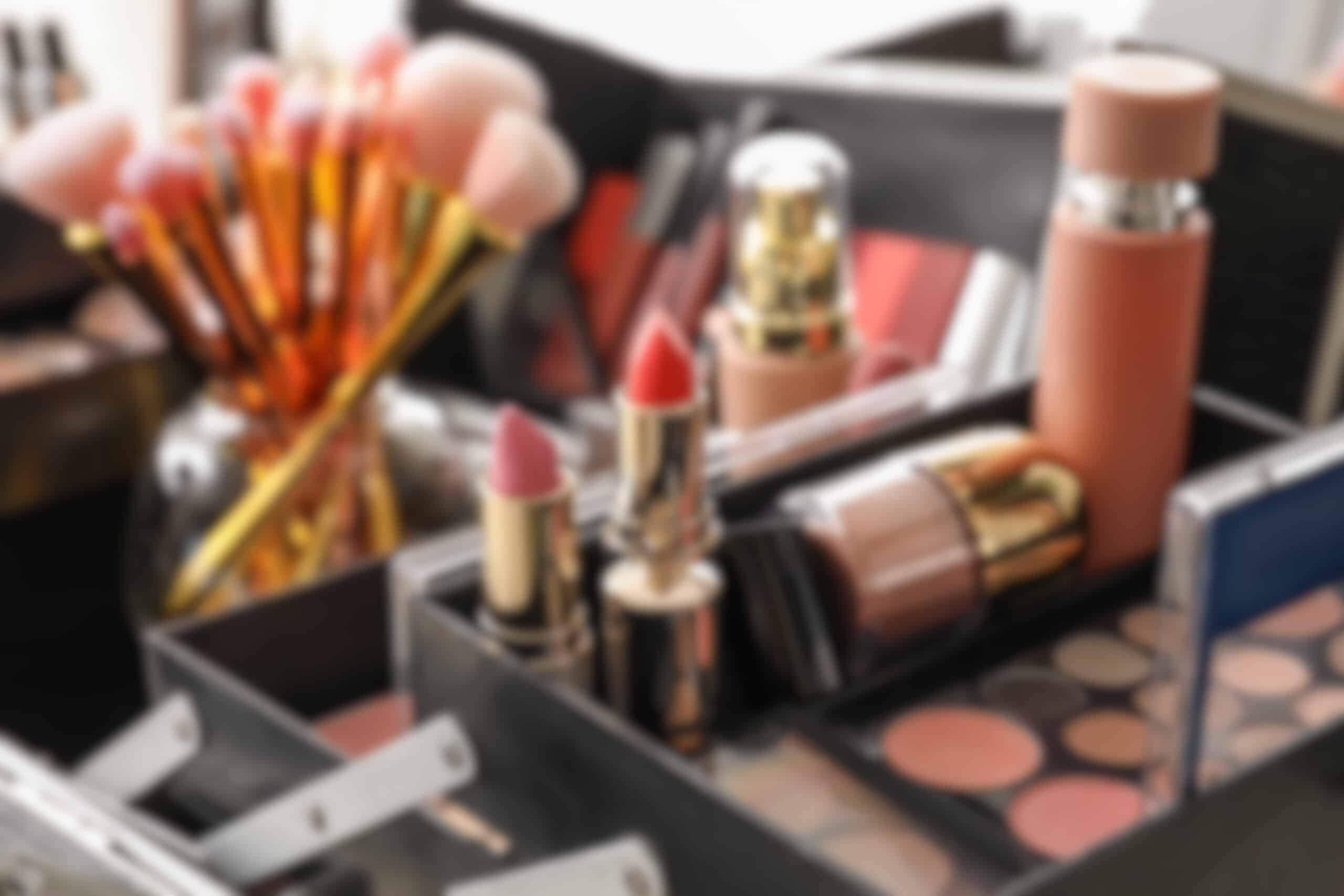 Professional makeup kit with brushes and lipsticks