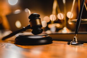 Judge’s gavel and scales of justice on desk