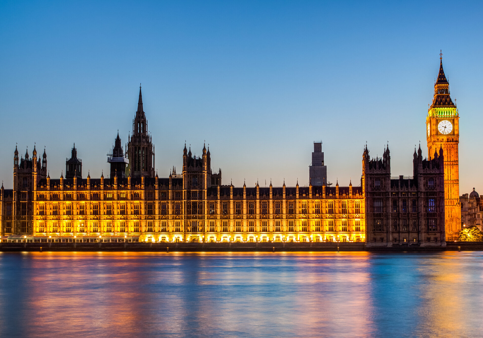 Night time photograph of the House of Lords from the river Thames