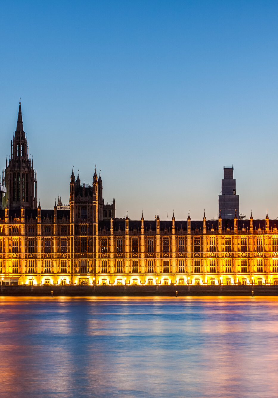 Night time photograph of the House of Lords from the river Thames
