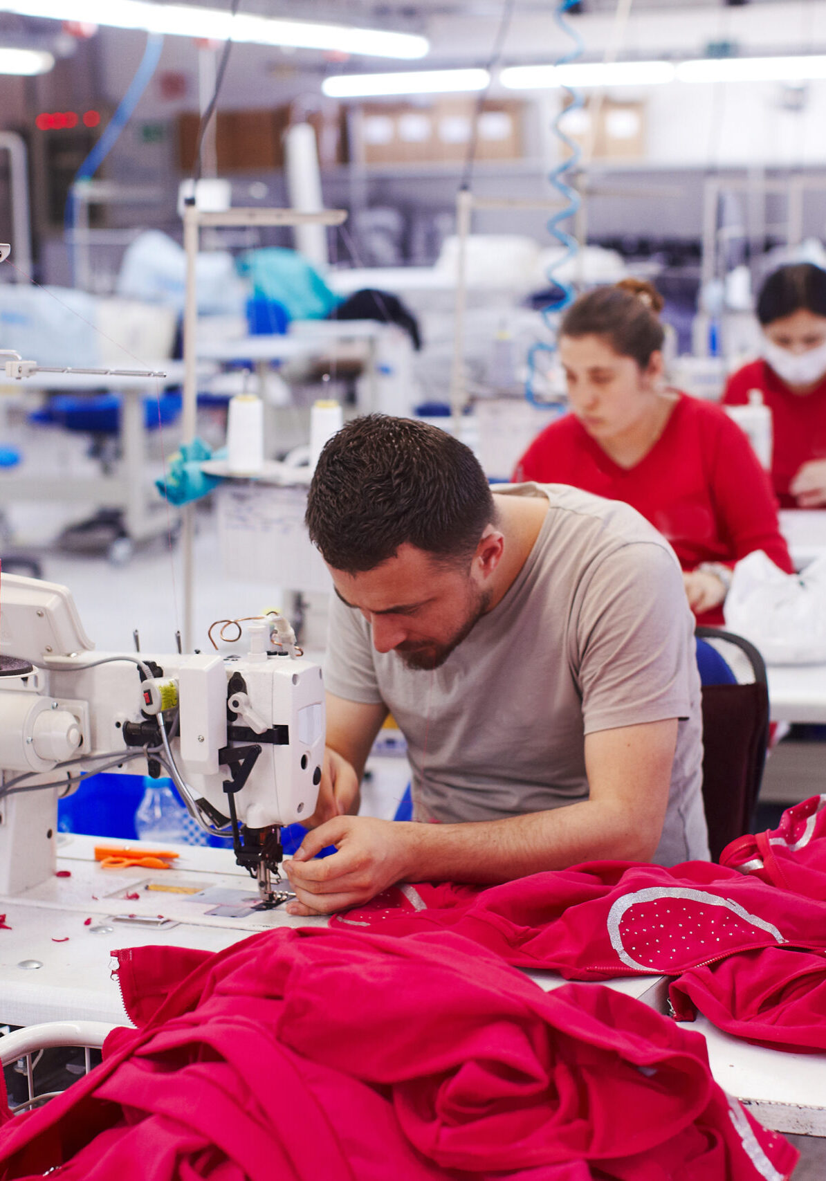 Factory workers sewing
